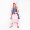 Girl wearing Jeune Premier New Bobbie Blush ergonomic school backpack, age 6 and up
