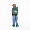 Boy wearing Jeune Premier New Bobbie Puffer Green school backpack, age 6 and up